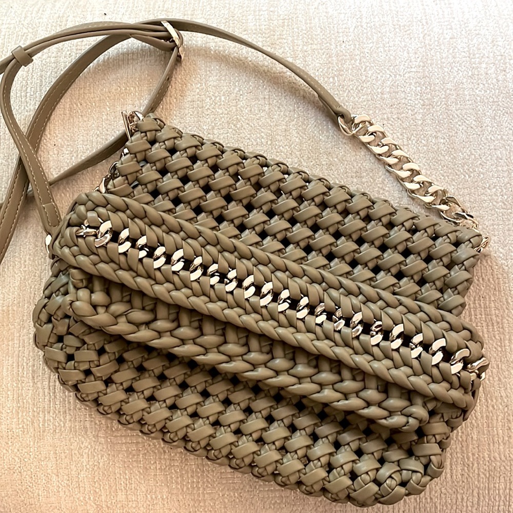 Woven chain clutch with gold tone removable chain.